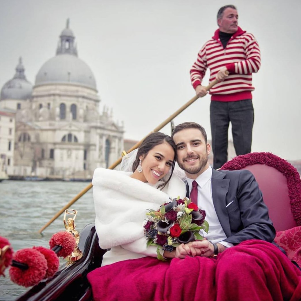 Сouple wearing a white gown and a black suit 2